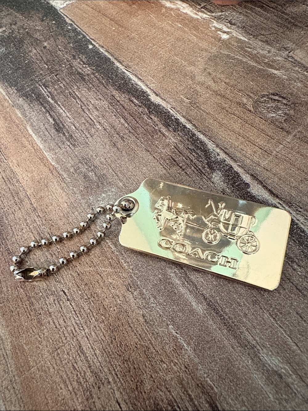 coach bag tag